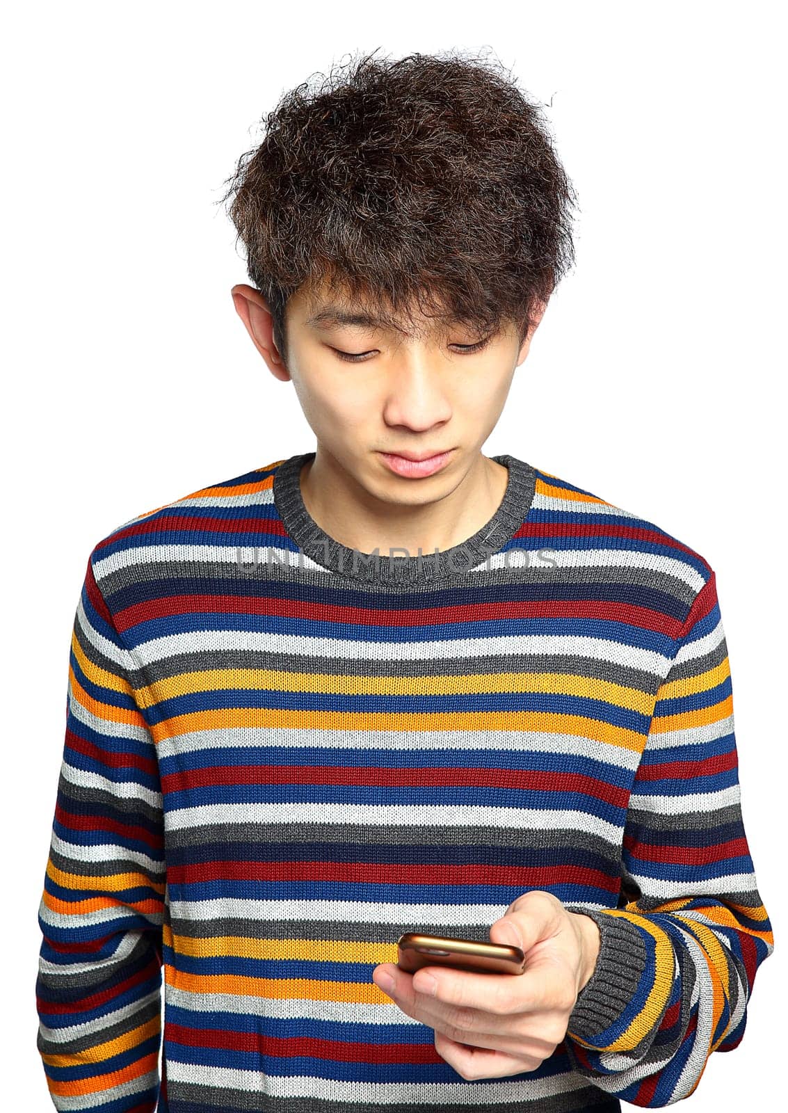 Young man using mobile phone texting on white background