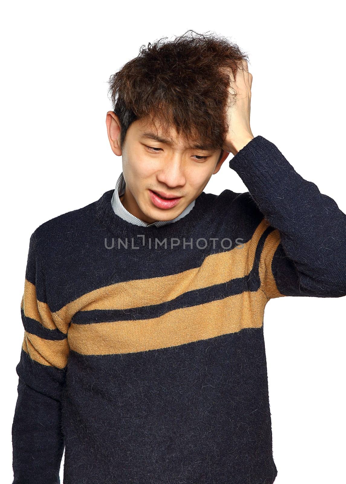 Closeup portrait, stressed young asian man, hands on head with bad headache, isolated background on white. Negative human emotion facial expression feelings.