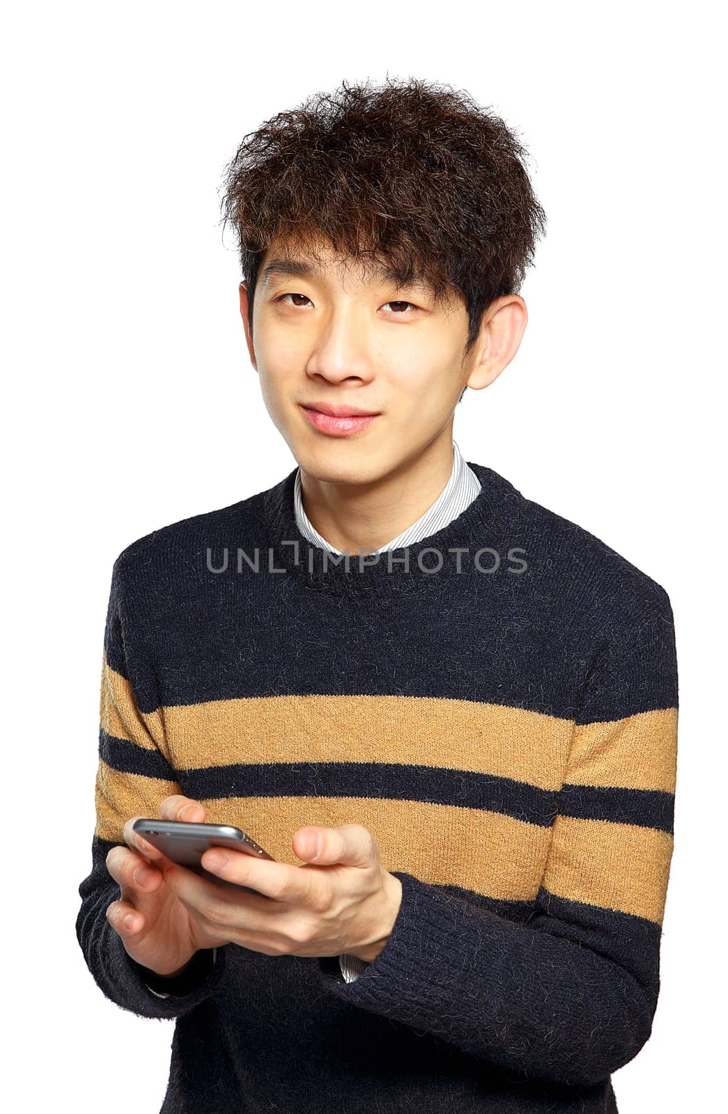 Young man using mobile phone SMS on white background