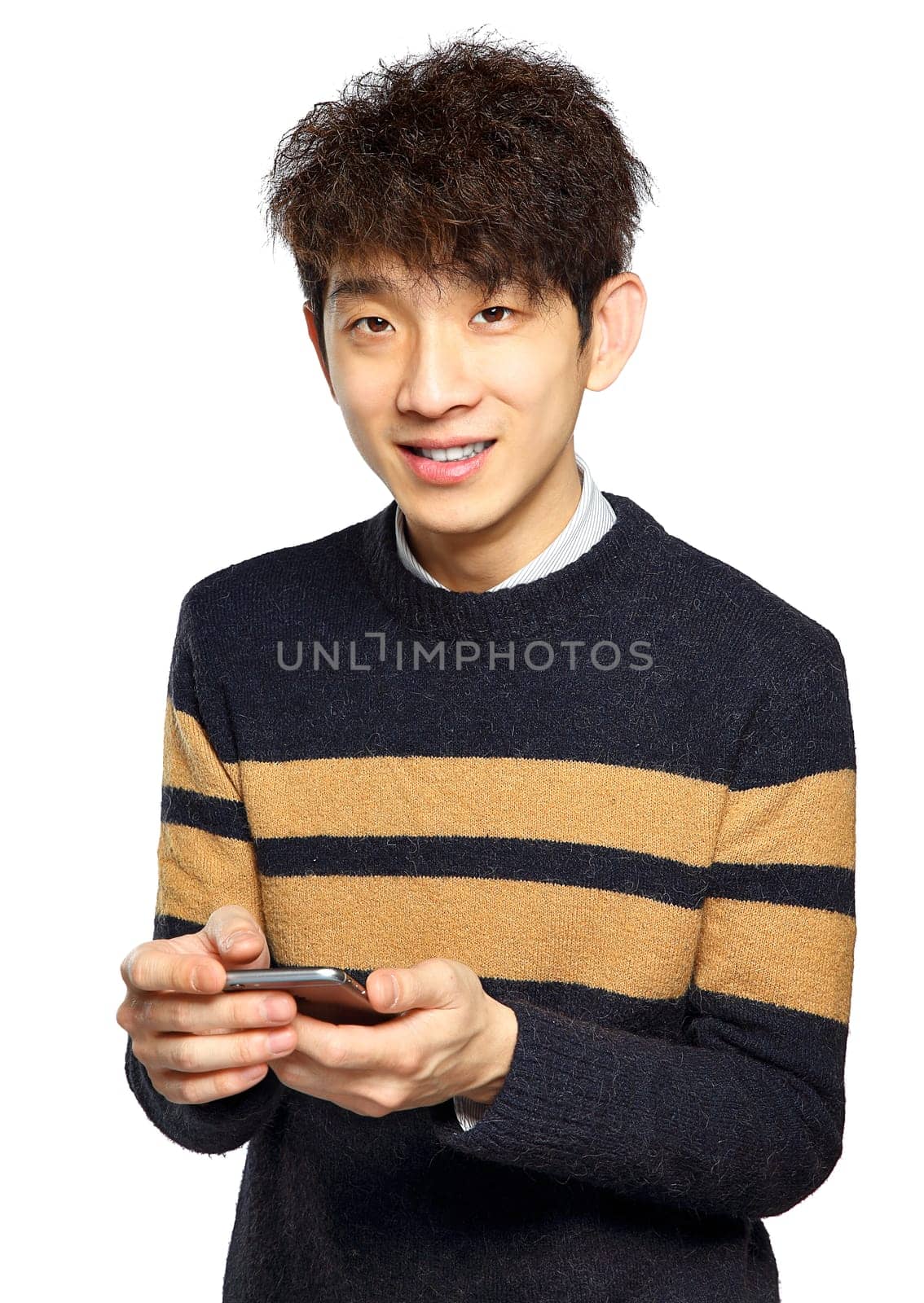Young man using mobile phone SMS on white background