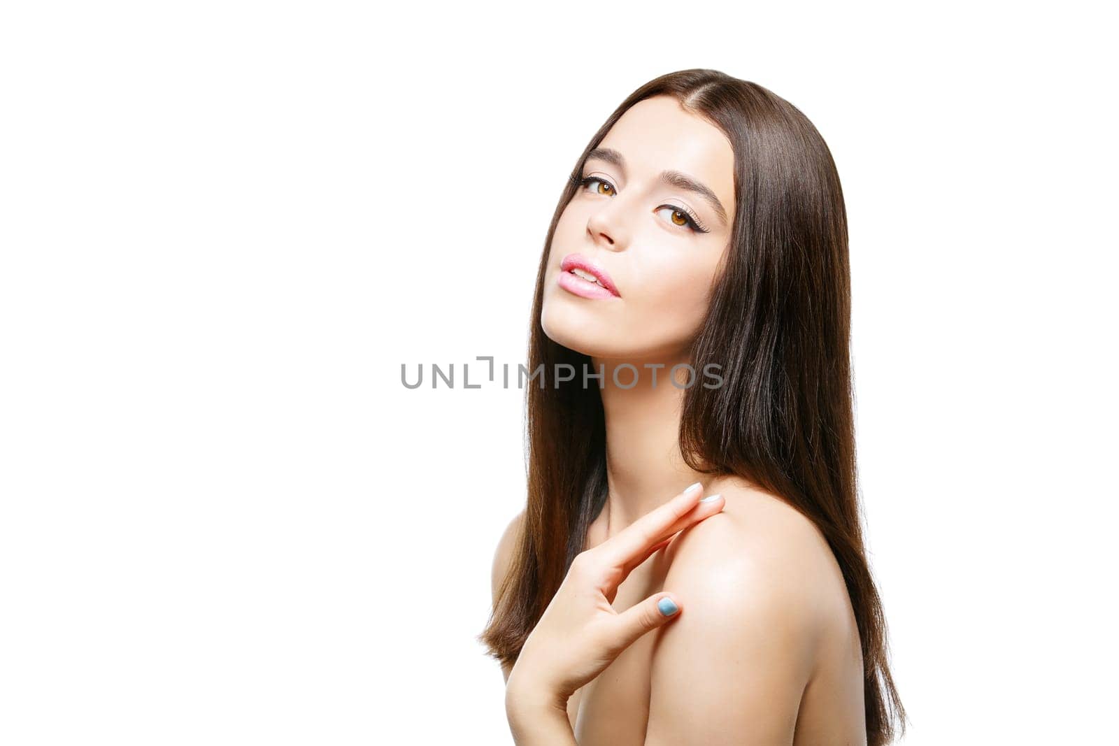Beautiful young woman with long dark hair. Isolated over white background. Copy space.