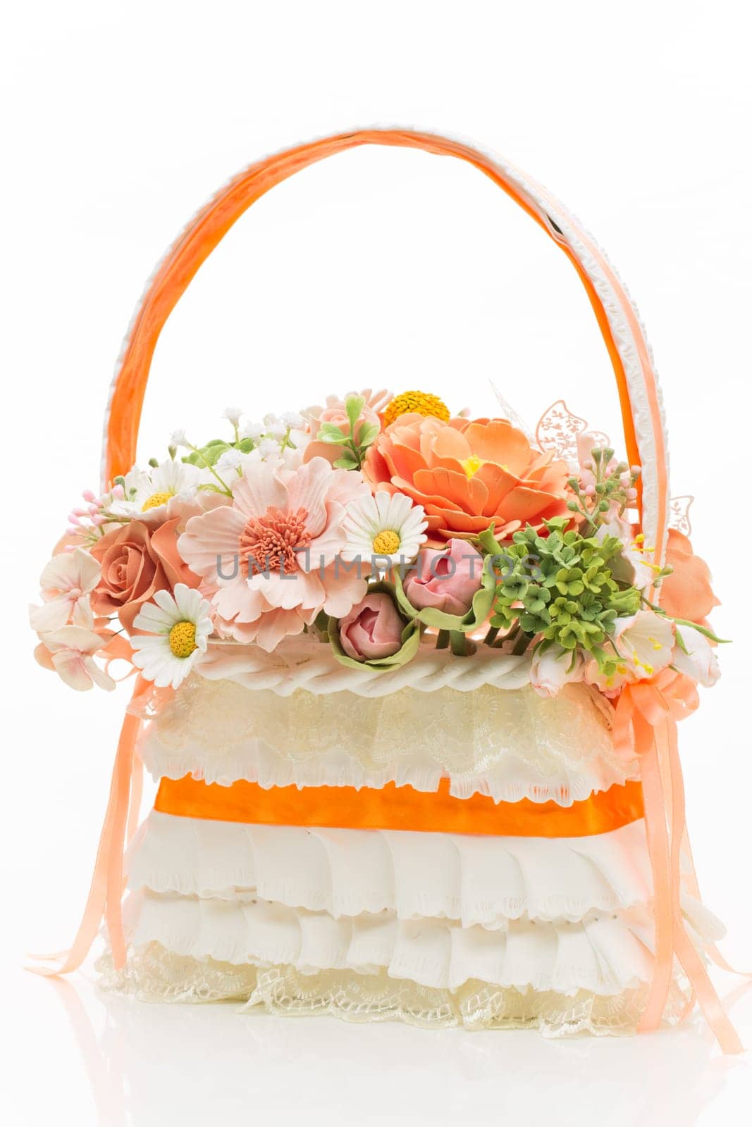 Stylish bridal bouquet made as basket with flowers isolated over white background