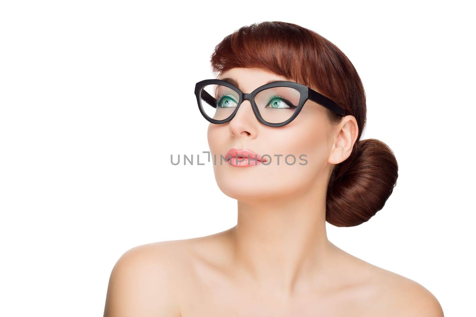 Beautiful young woman with red hair and makeup in glasses Beauty shot. Isolated over white background. Copy space.