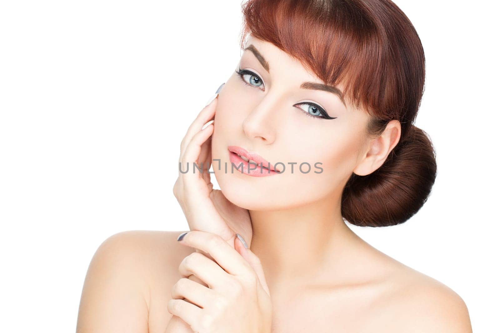 Beautiful young woman with perfect skin and red hair isolated over white background. Copy space.