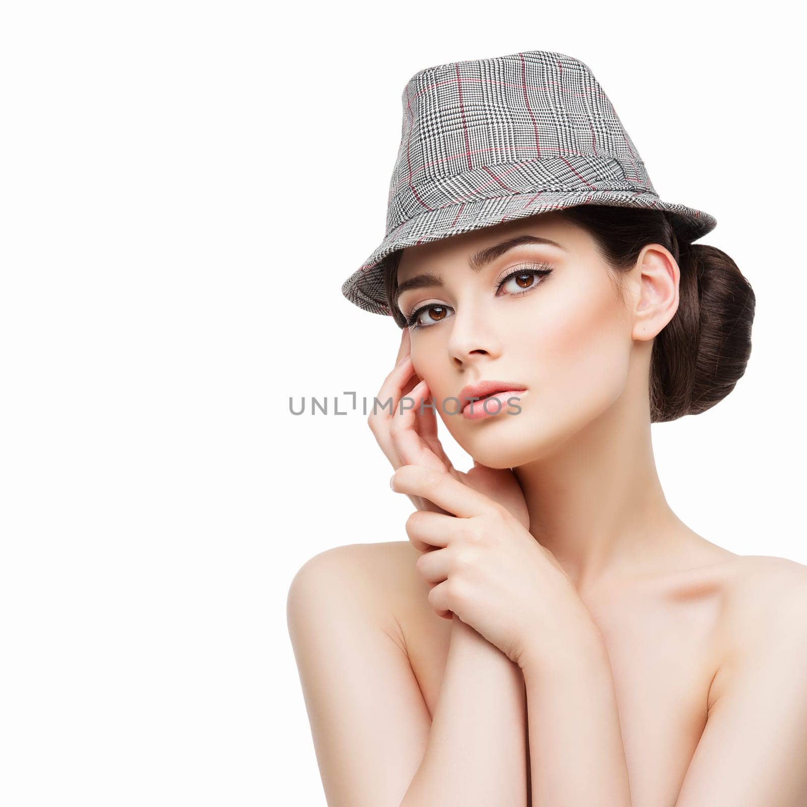 Portrait of beautiful young woman in fancy hat with natural make-up. Isolated over white background. Copy space. Square composition.