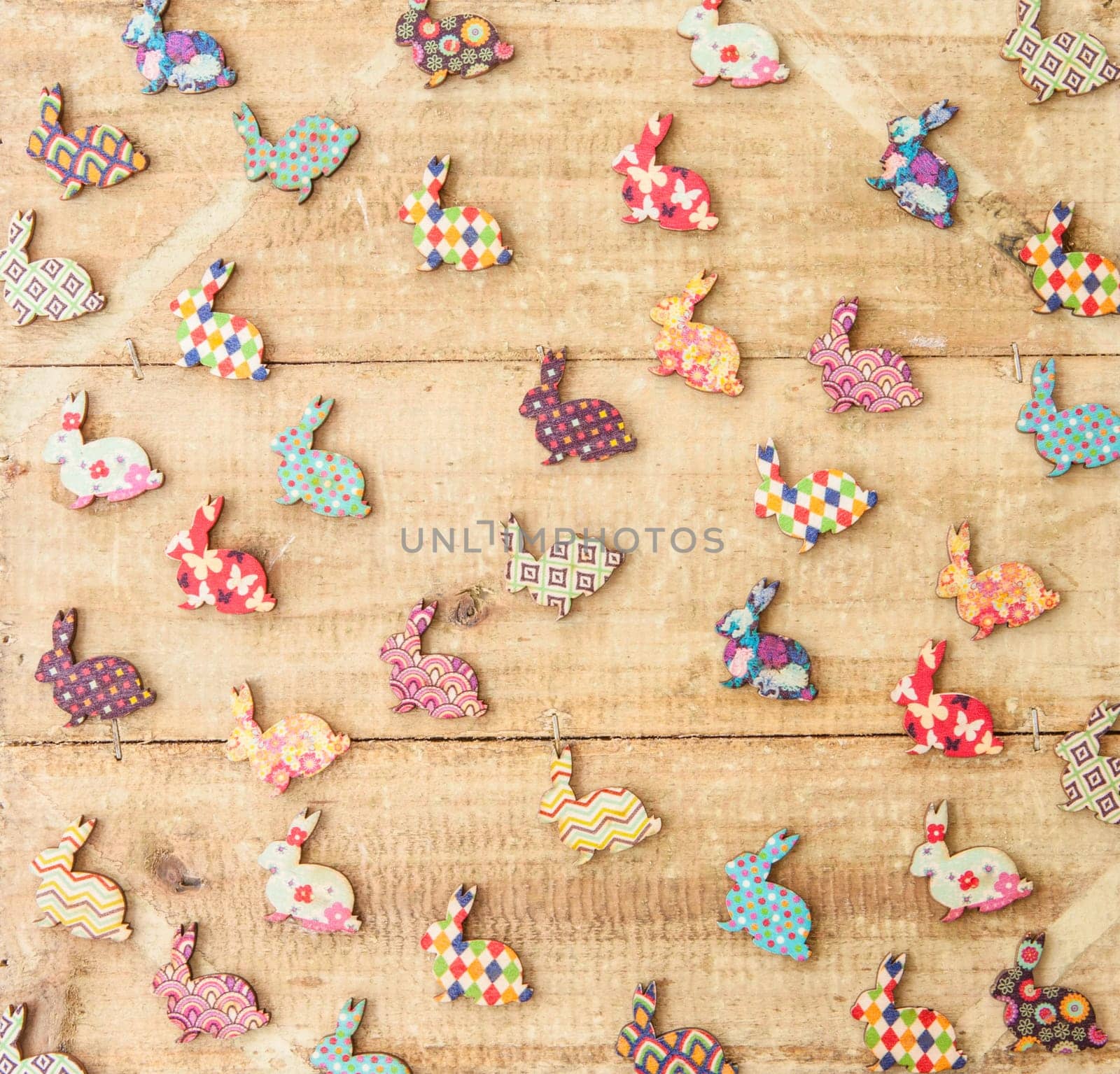 Colorful ashes on rustic wood as a background for Easter