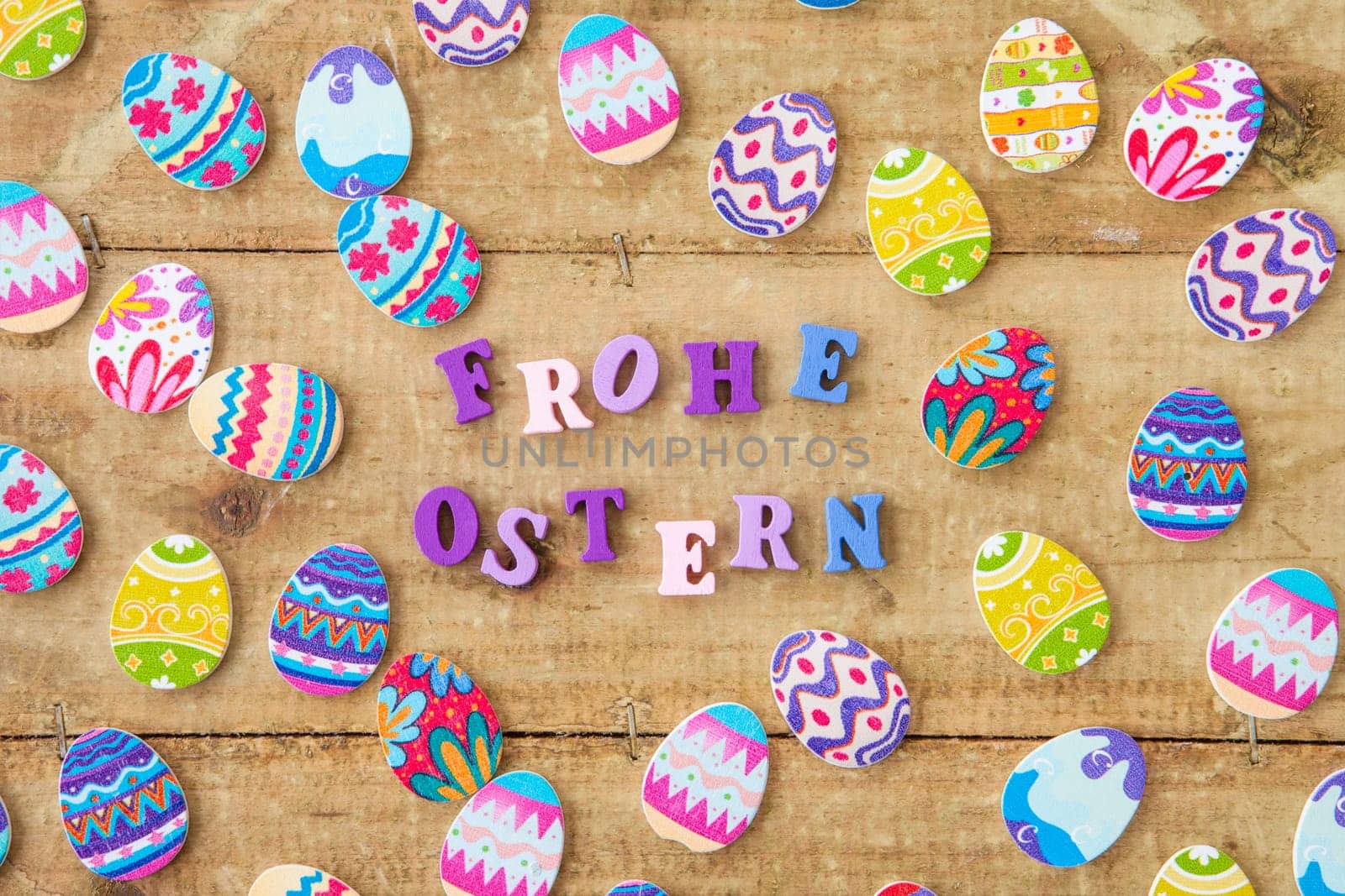 Colorful eggs on rustic wood as a background for Easter