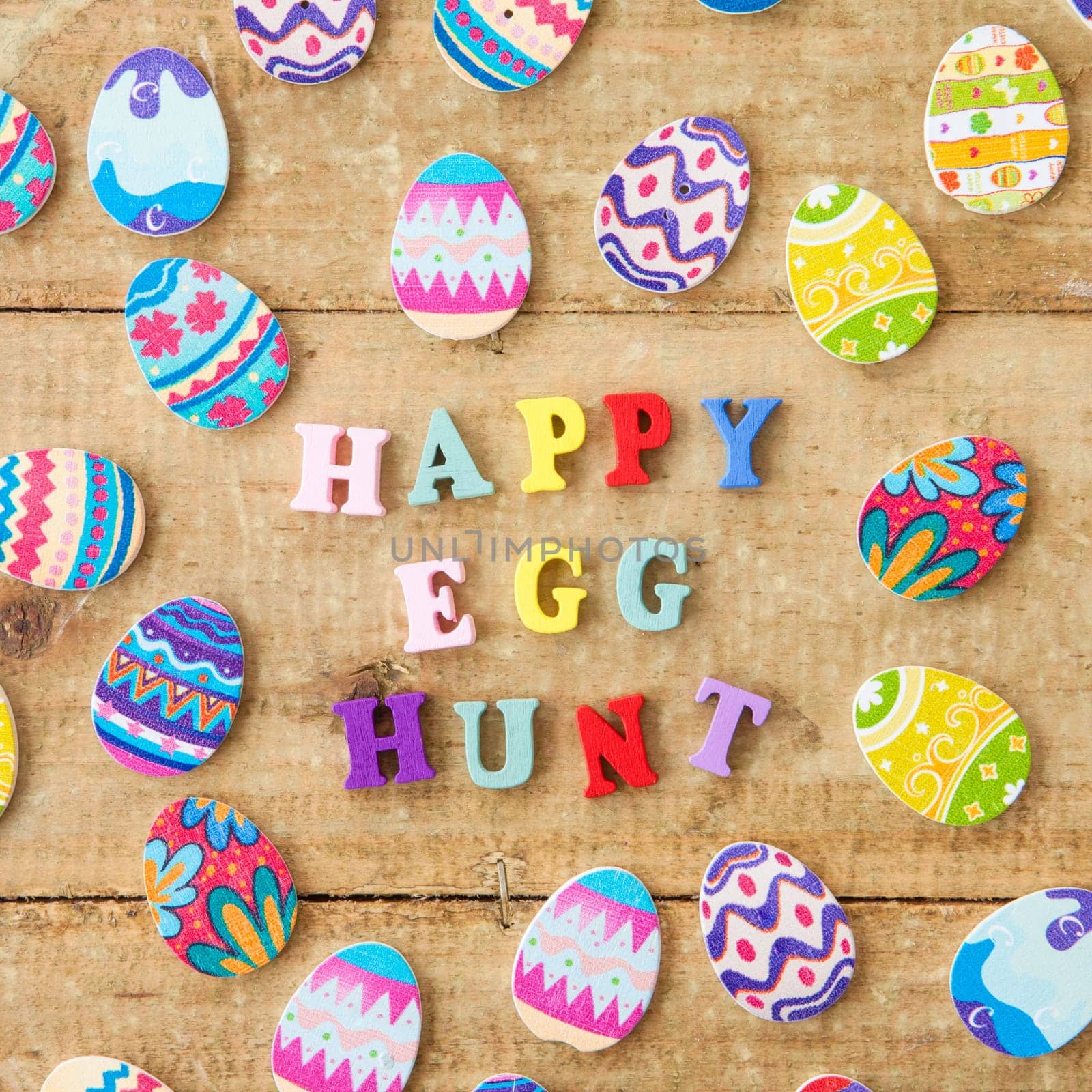 Colorful eggs on rustic wood as a background for Easter