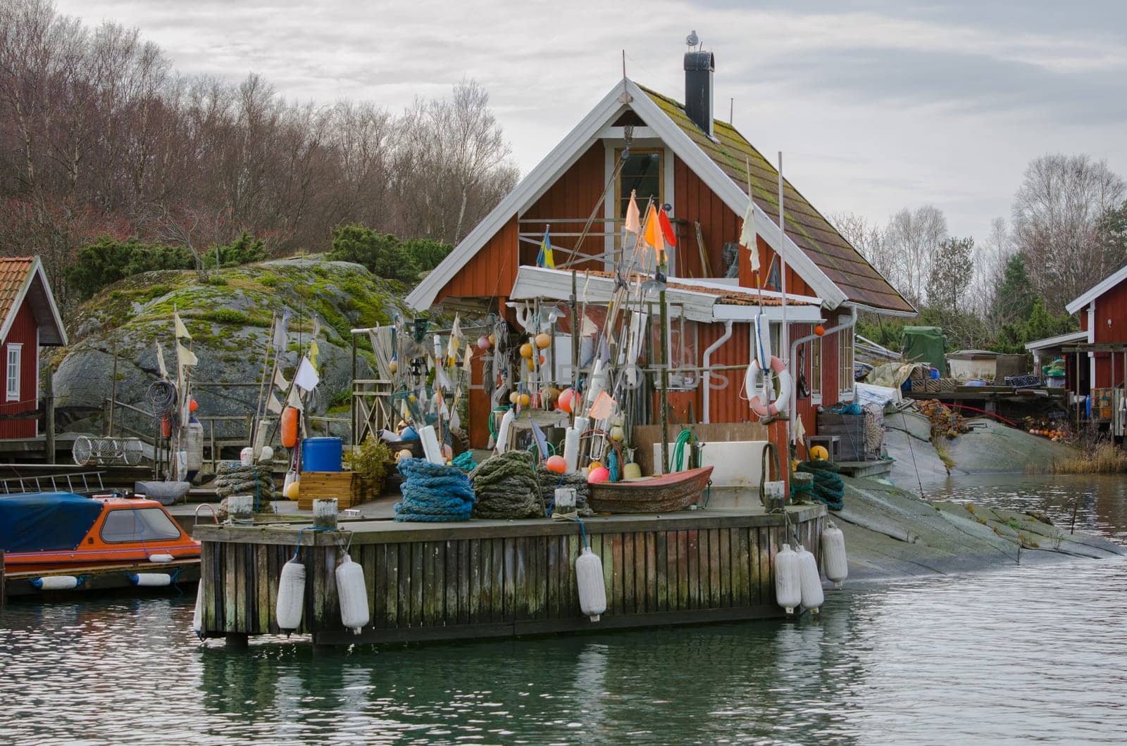 fishermans boathouse and boat with pier waiting to go out and fish