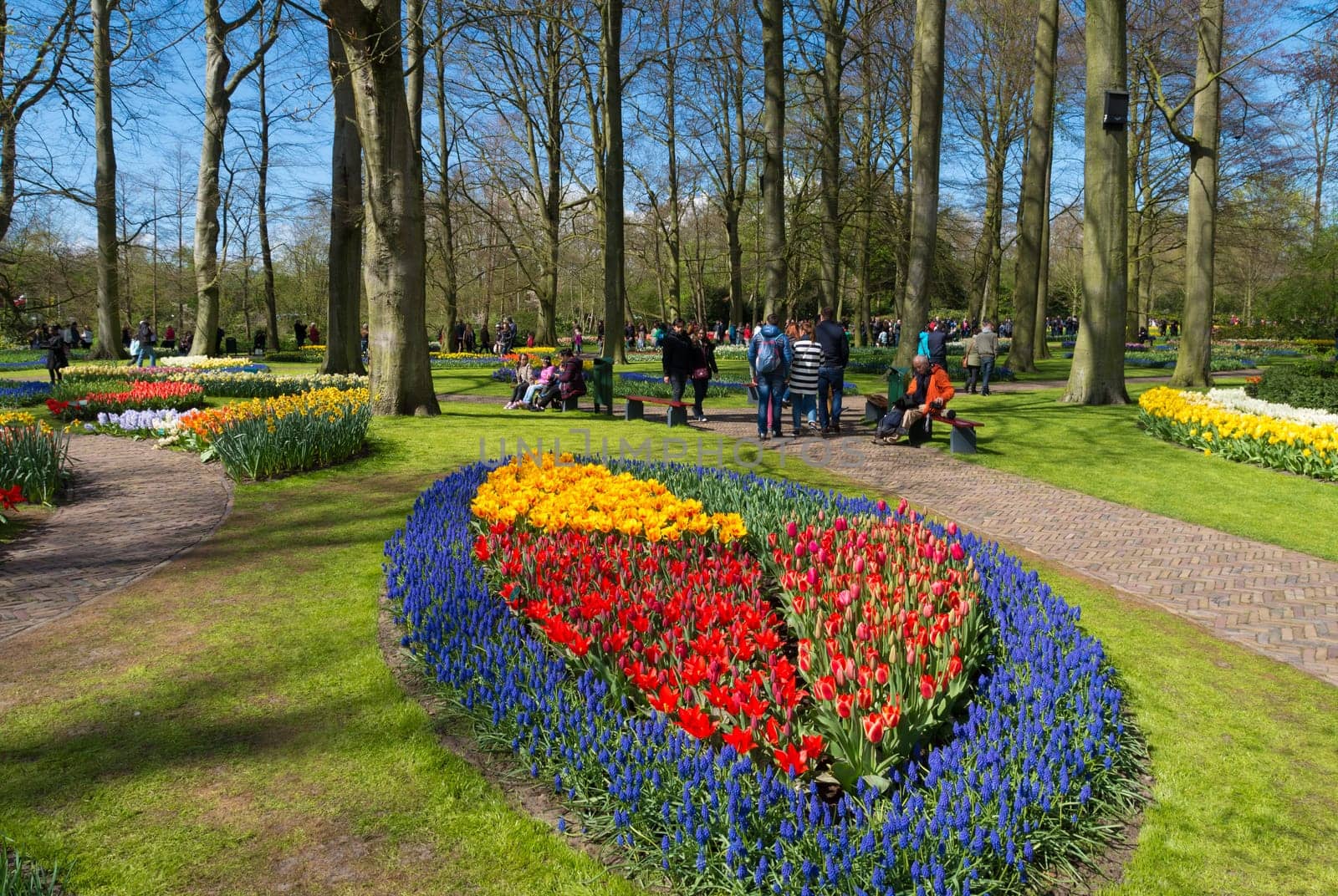 LISSE, NETHERLANDS - APRIL 17, 2016: Unknown tourists visiting the famous keukenhof tulip gardens in the netherlands