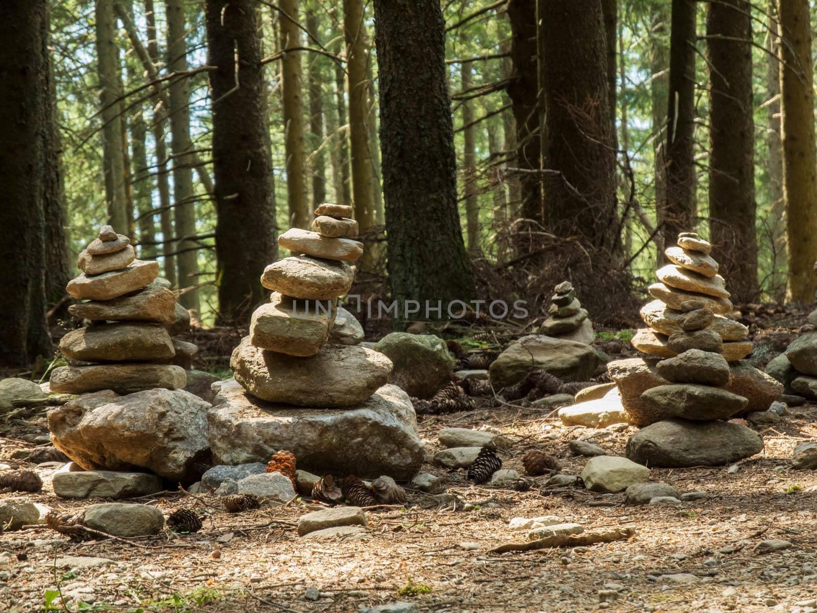 Group of cairns (colloquially: Steinmännchen) on a mountain hiking trail in South Tyrol above Merano in summer.