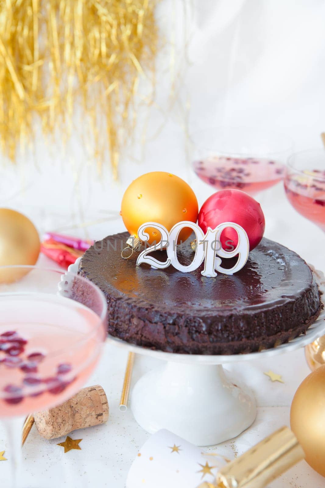 New Year's Eve party with chocolate cake and rose sparkling wine