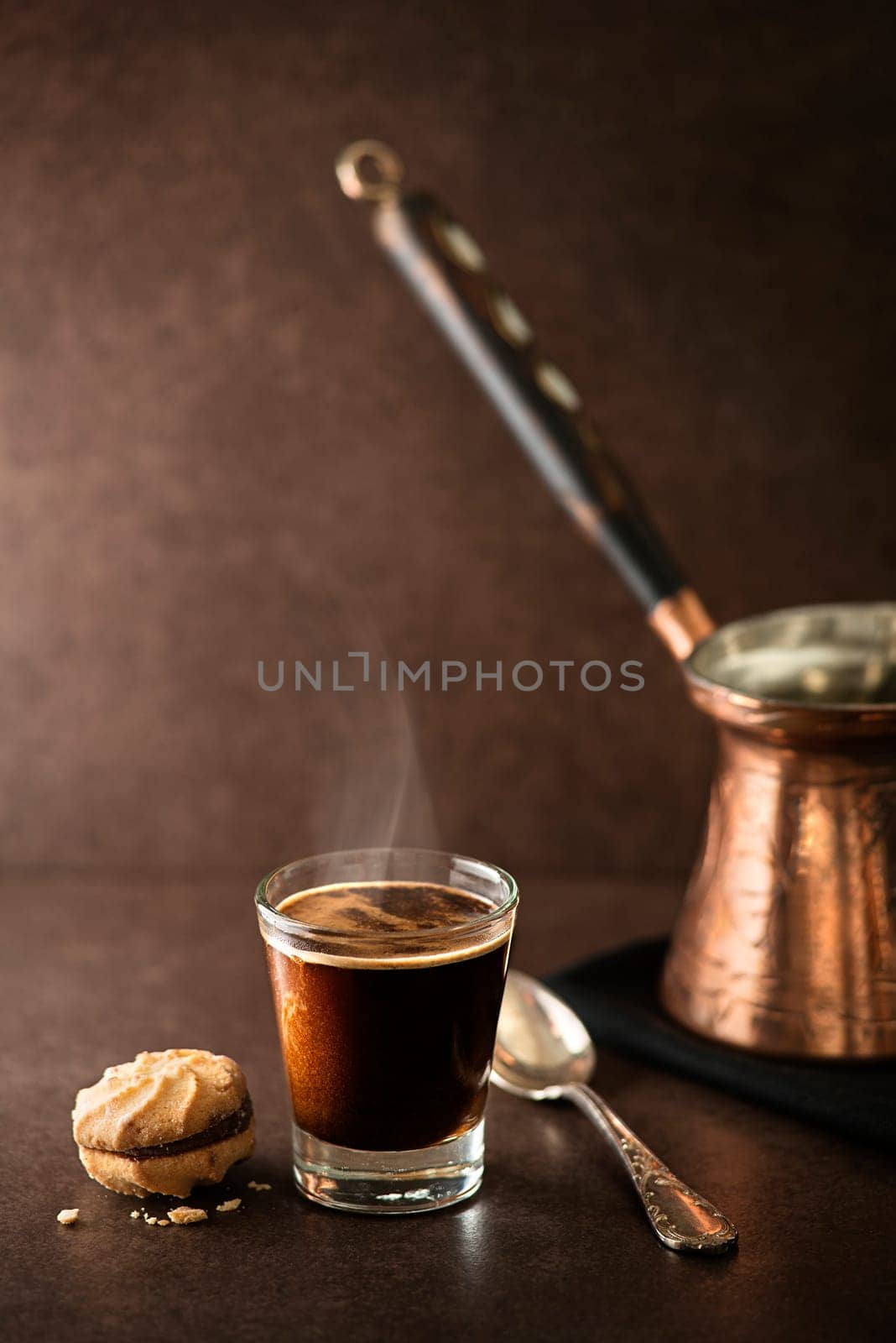 Cup of espresso coffee on dark background