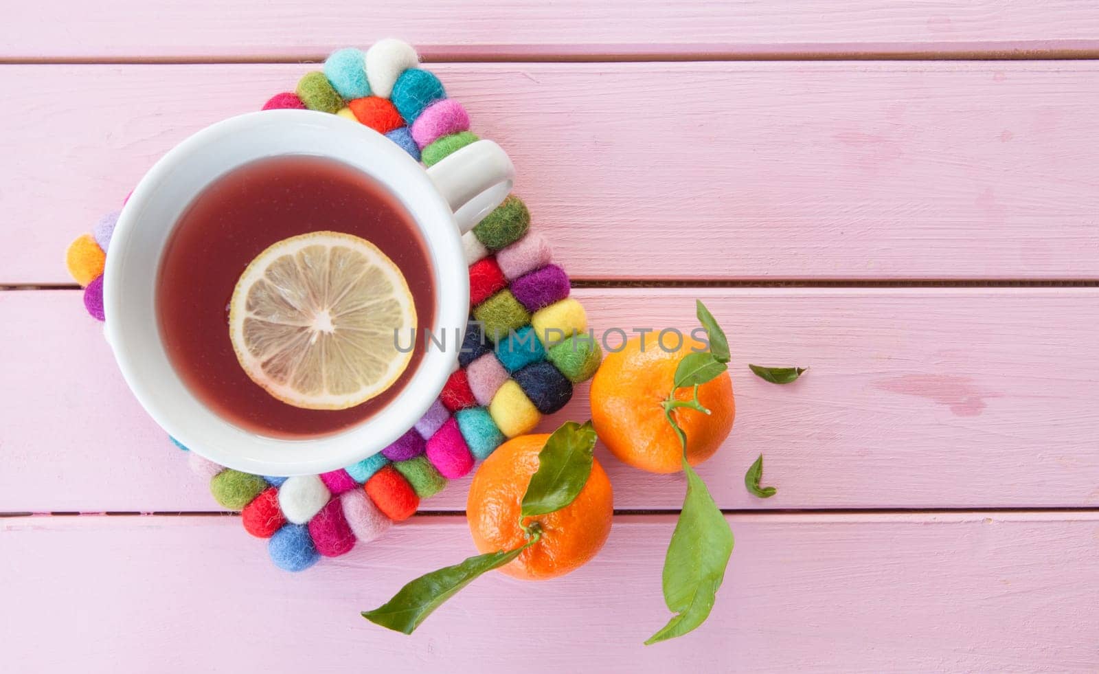 Cup of tea with lemon and fresh manderines