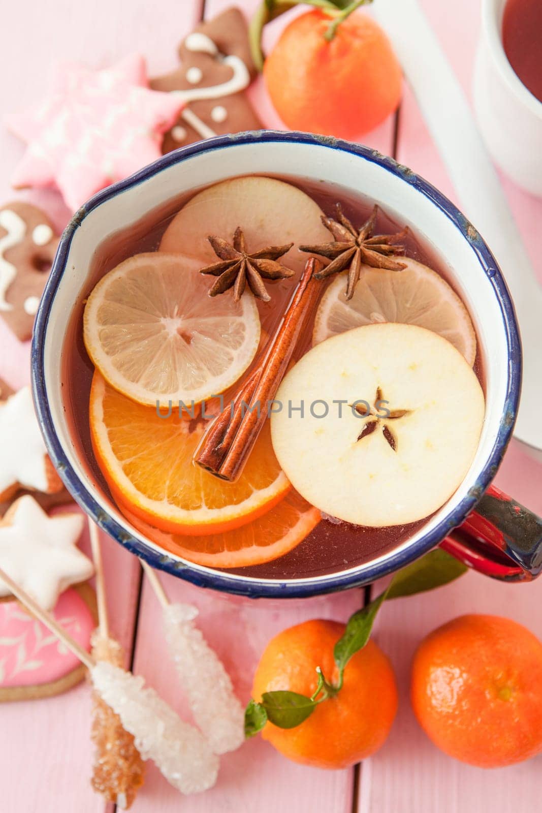 Homemade winter punch with oranges and waxes
