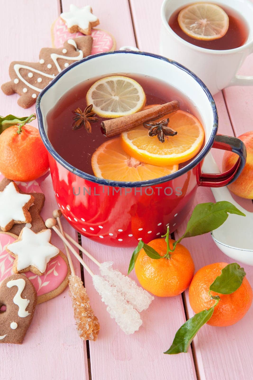 Homemade winter punch with oranges and waxes