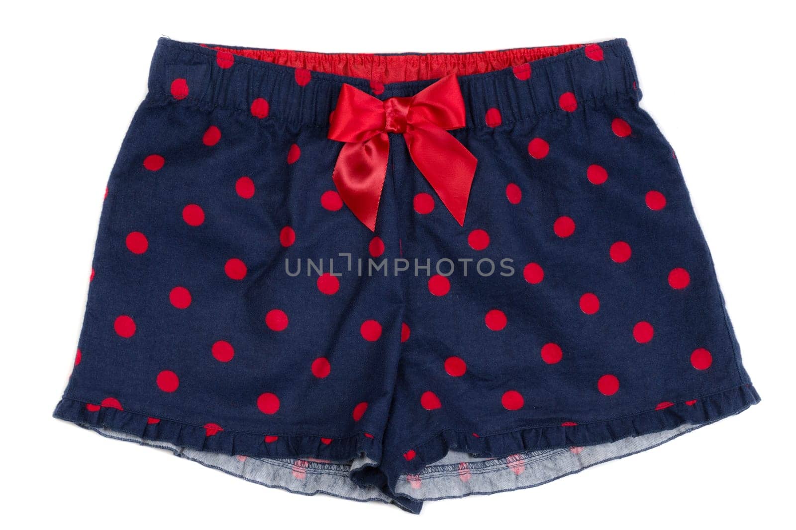 Blue women's panties with red polka dots on white isolate.