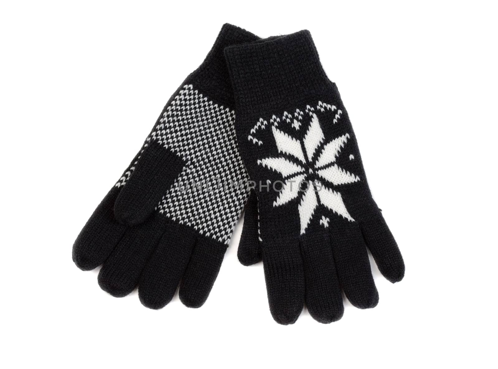 Black knit gloves with a snowflake pattern. Isolate on white.