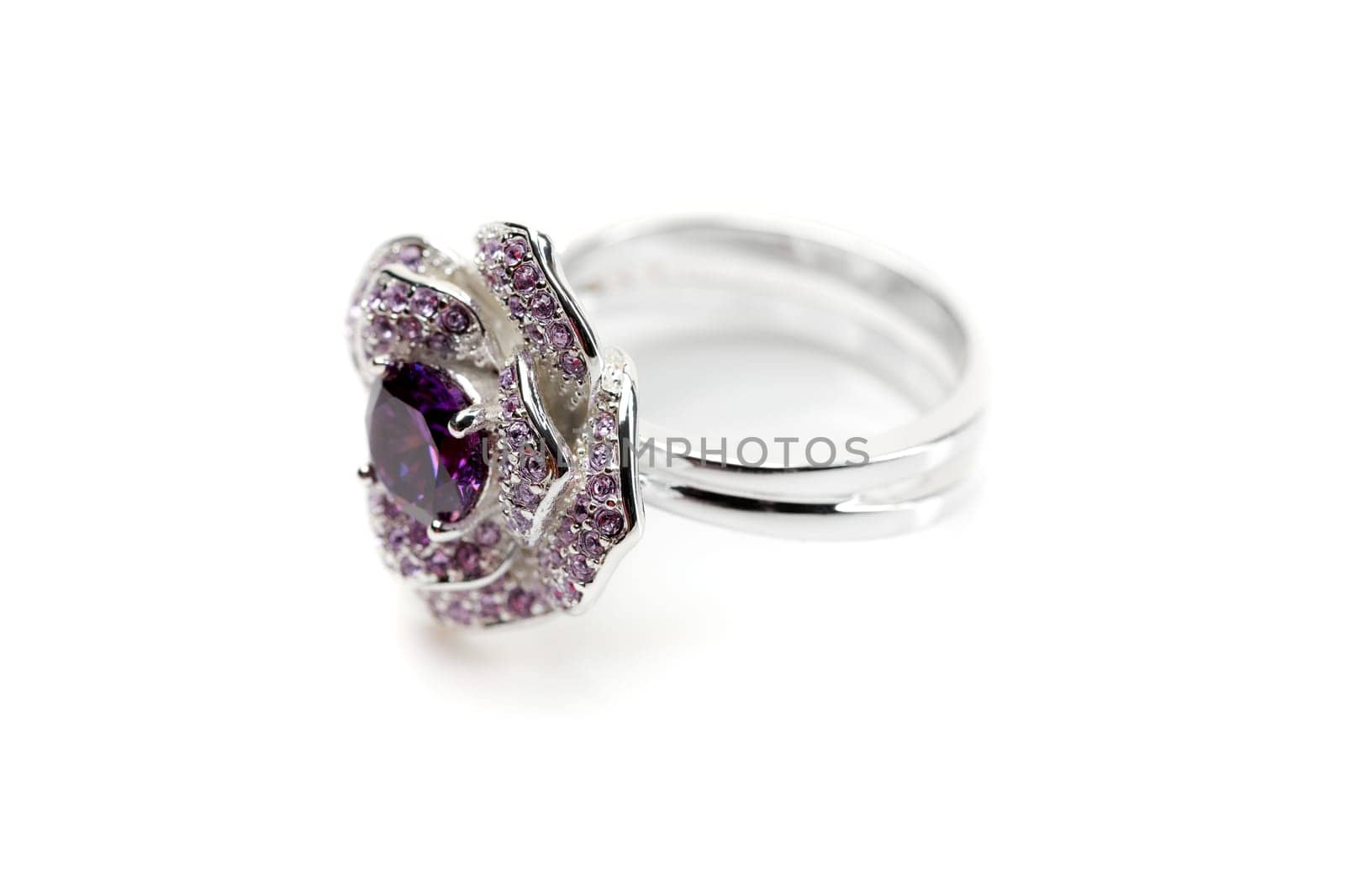 Silver ring with a purple stone isolated on white background