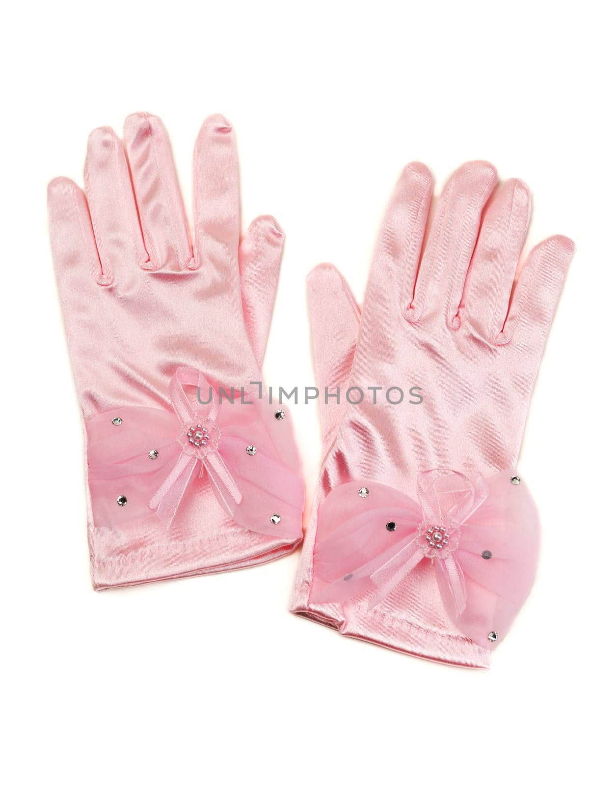 Pair of pink silk gloves with rhinestones. Isolate on white.