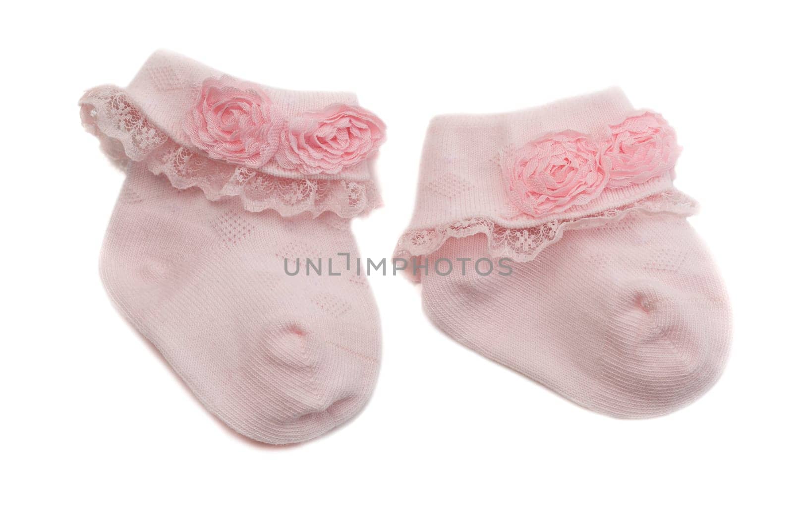 Pink baby socks. Isolate on white.
