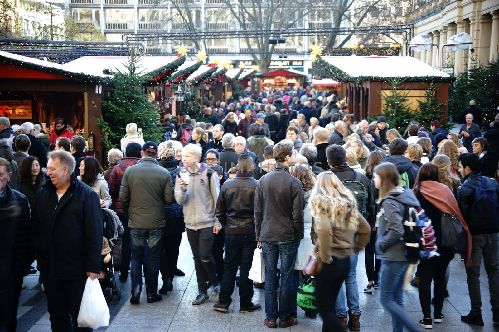 Cologne,Germany – November 24,2016: Crowds at the well-attended Christmas market at Cologne Cathedral with Christmas stalls on November 24,2016 in Cologne.