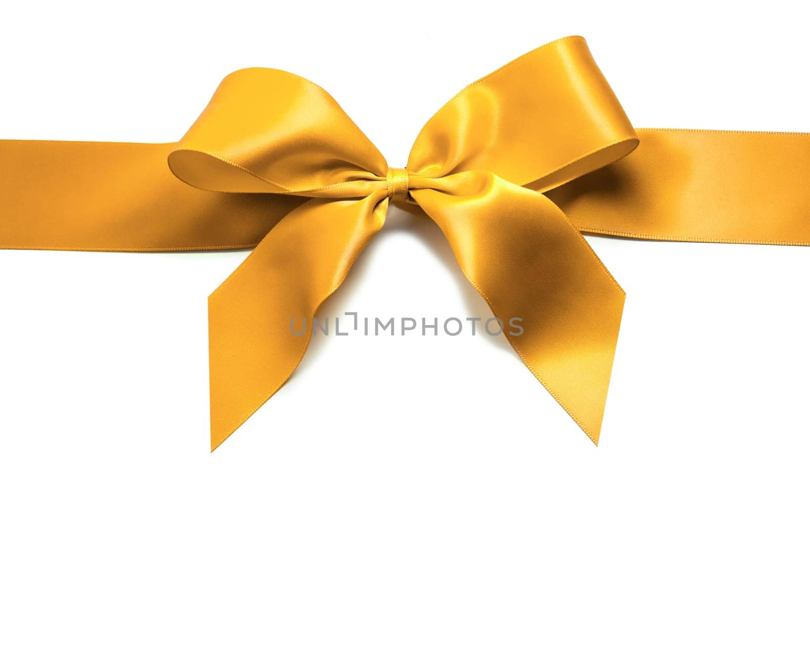 Gold satin ribbon and bow isolated on white