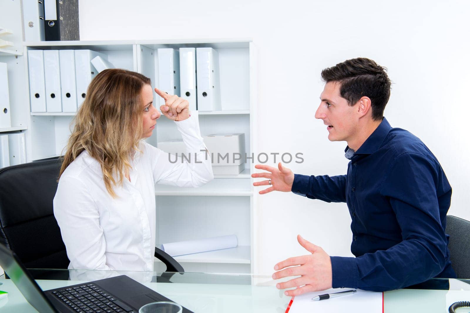 young business man and business woman in conflict