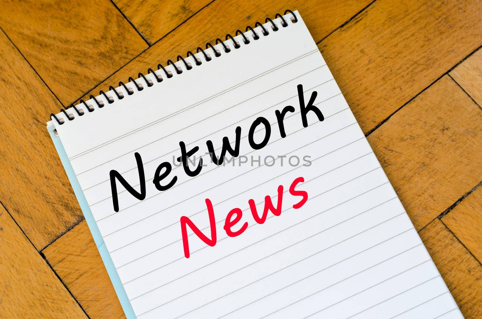 Network news text concept write on notebook