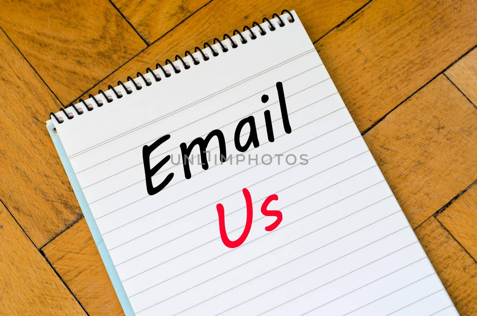 Email us text concept write on notebook