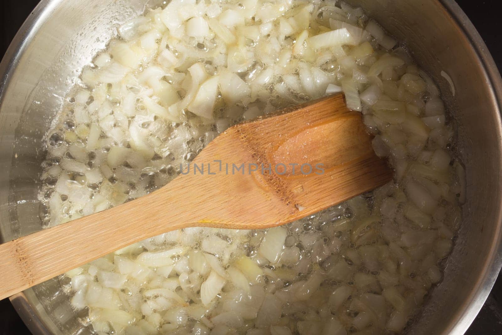 Frying chopped onion in a pan