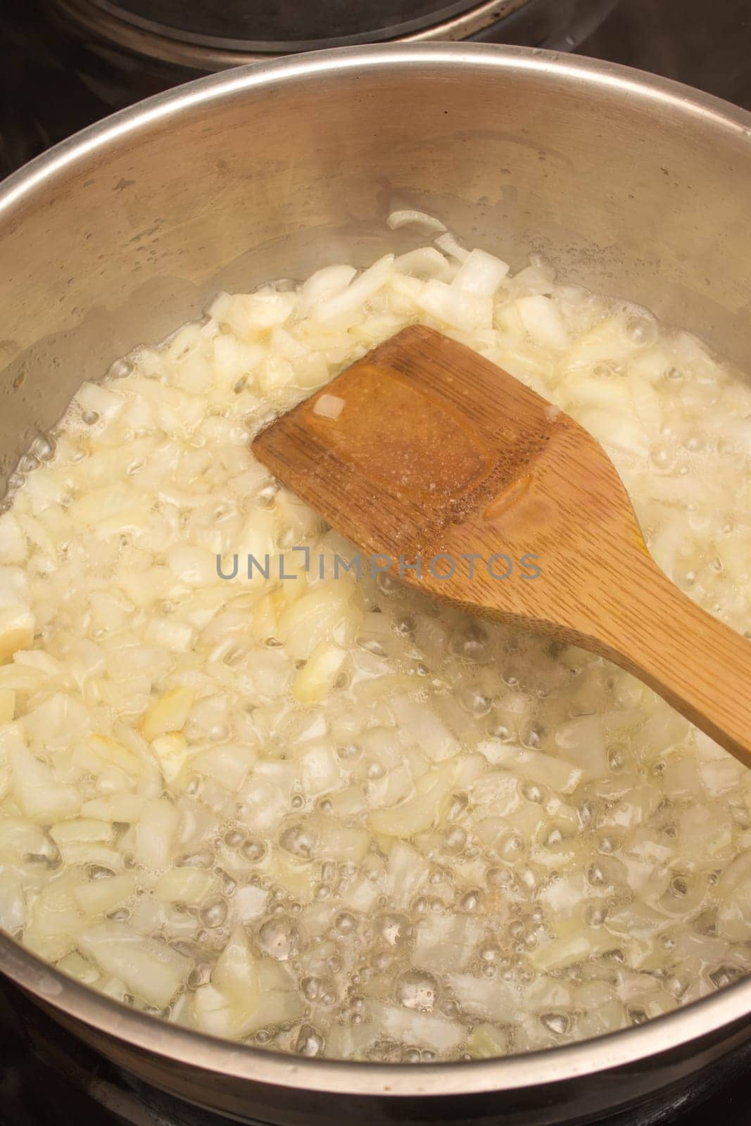 Frying chopped onion in a pan