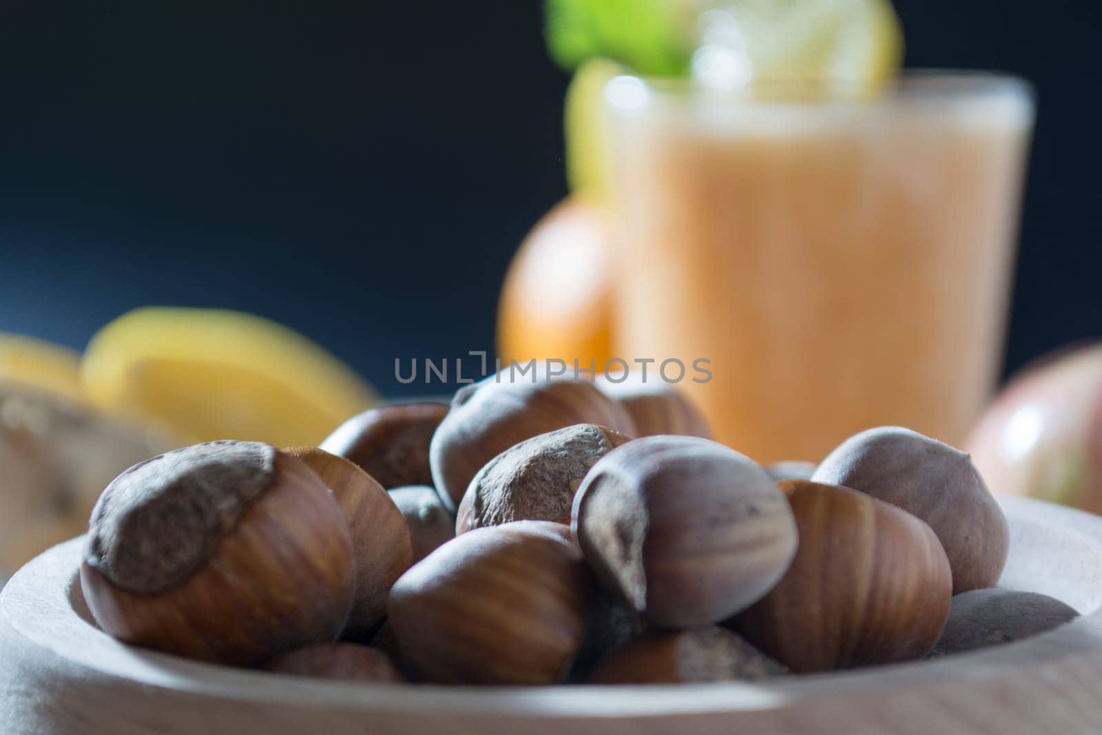 Hazelnuts  in wooden bowl ready to be cracked and eaten