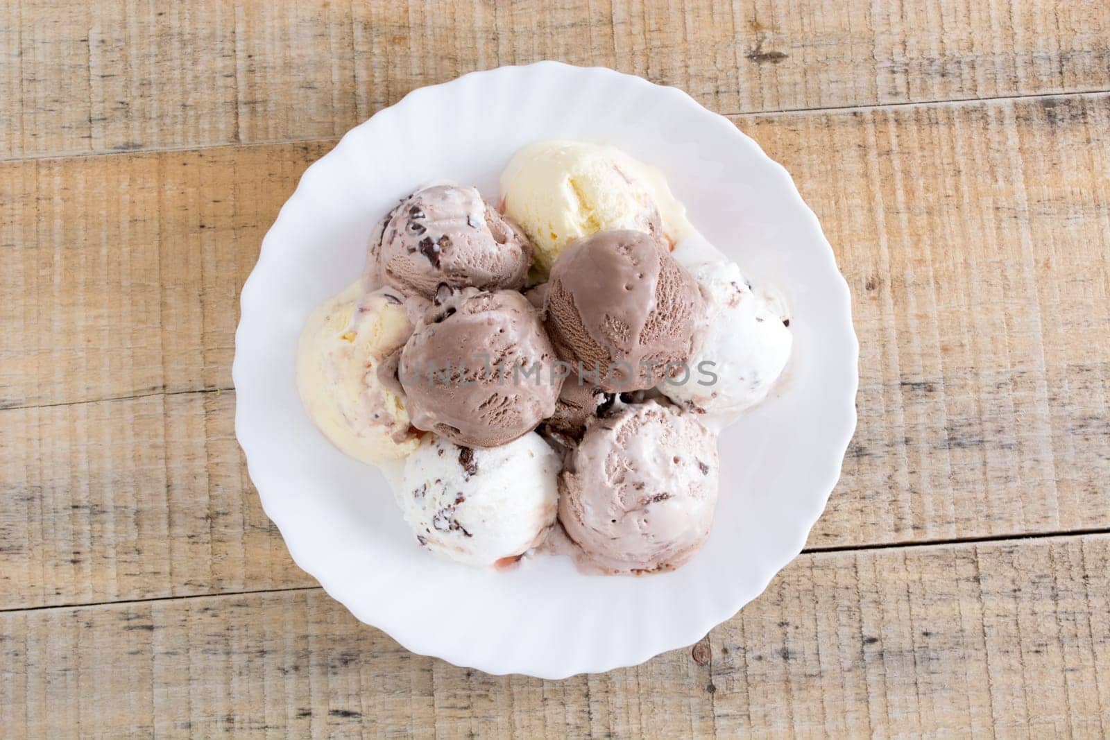 Scoops of chocolate ice cream in the white plate