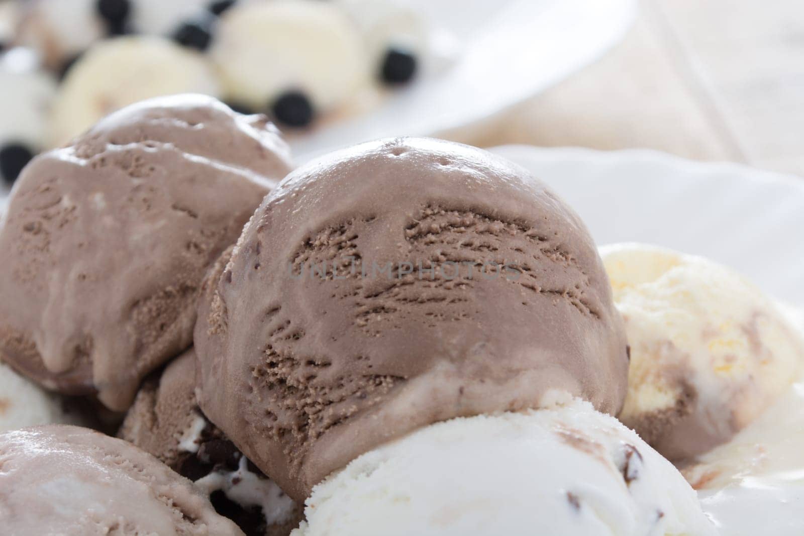 Scoops of chocolate ice cream in the white plate