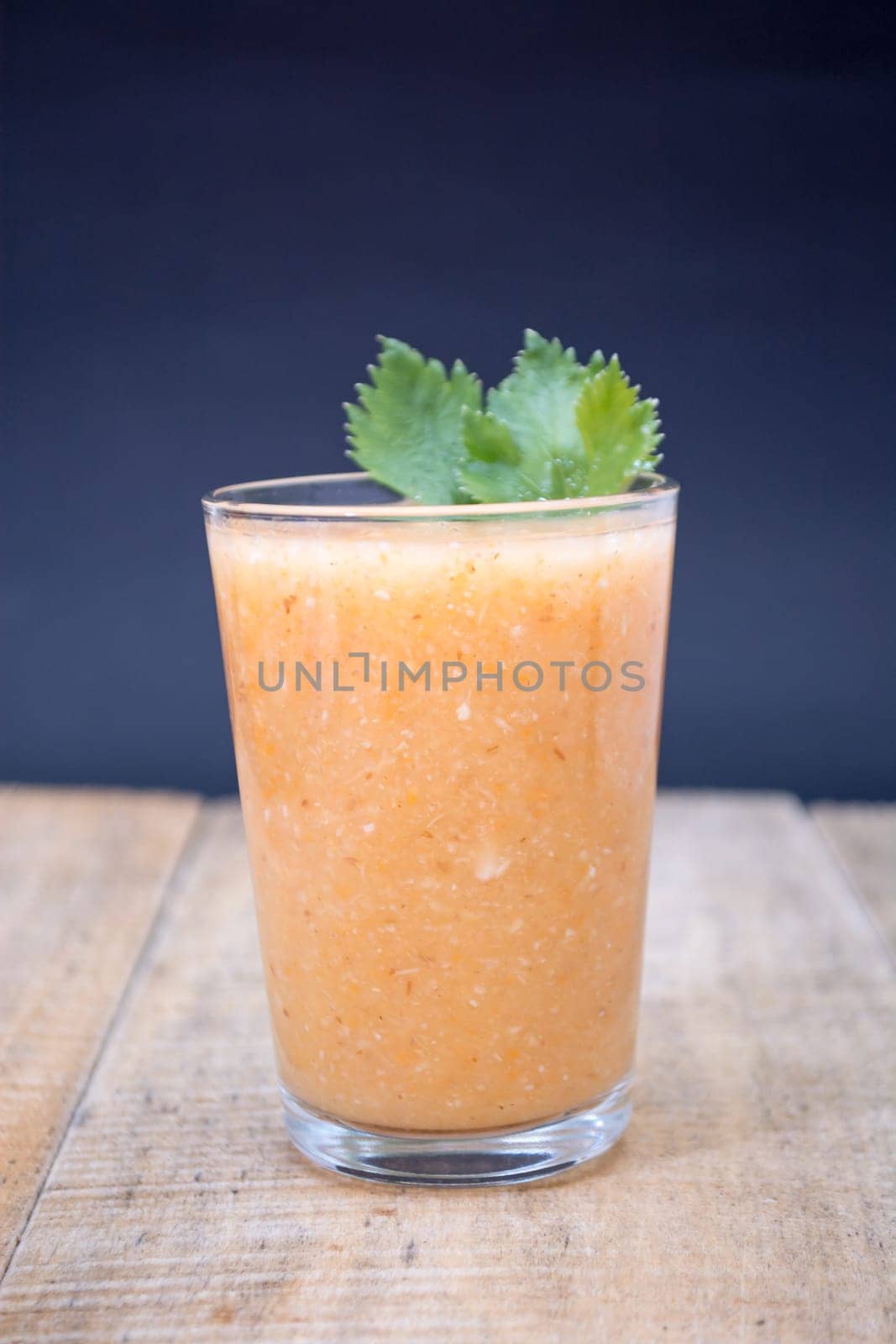 Fresh lemonade with ginger decorated with green celery leaves
