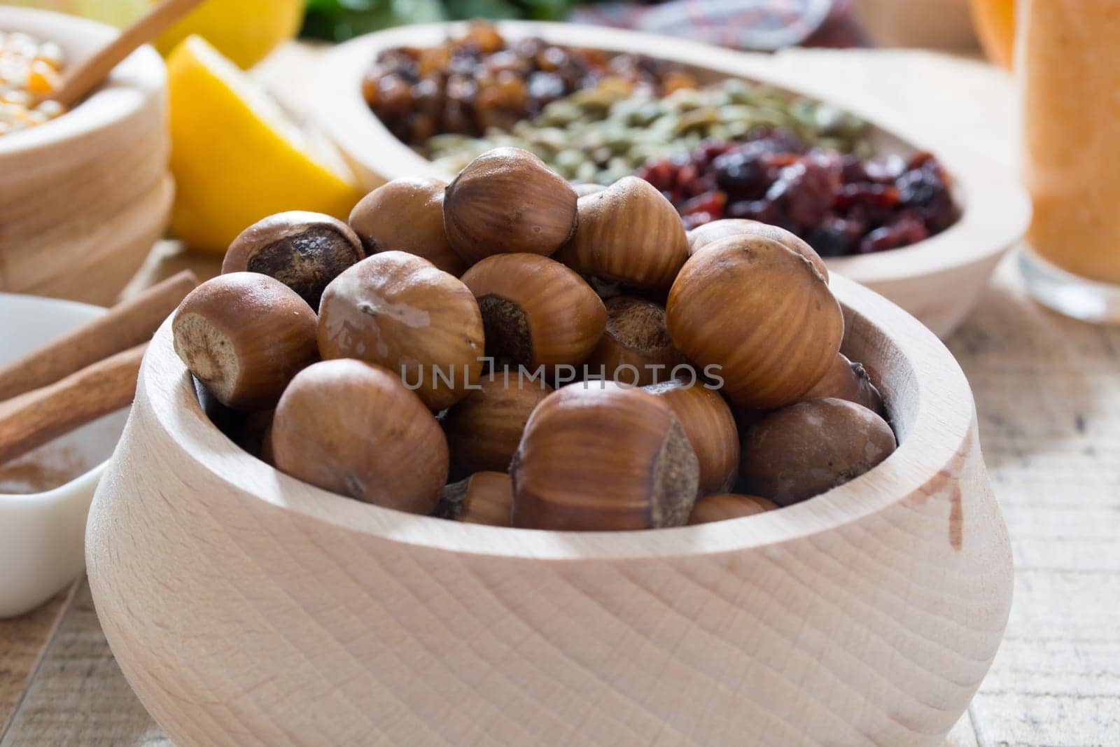 Hazelnuts  in wooden bowl ready to be cracked and eaten