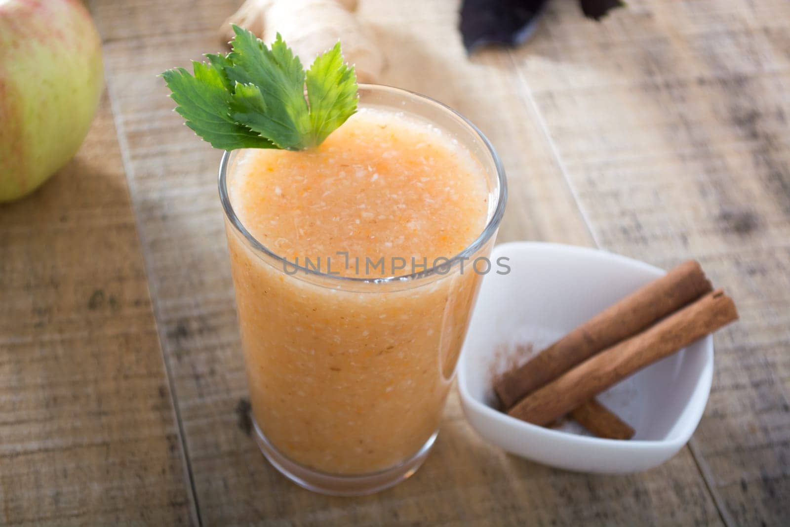 Healthy ginger drink served with cinnamon sticks
