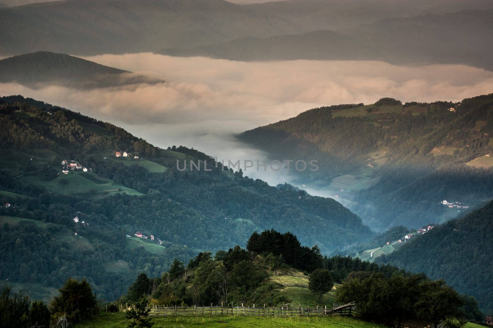 Shoot of clouds between mountains in national park Tara in Serbia in early morning