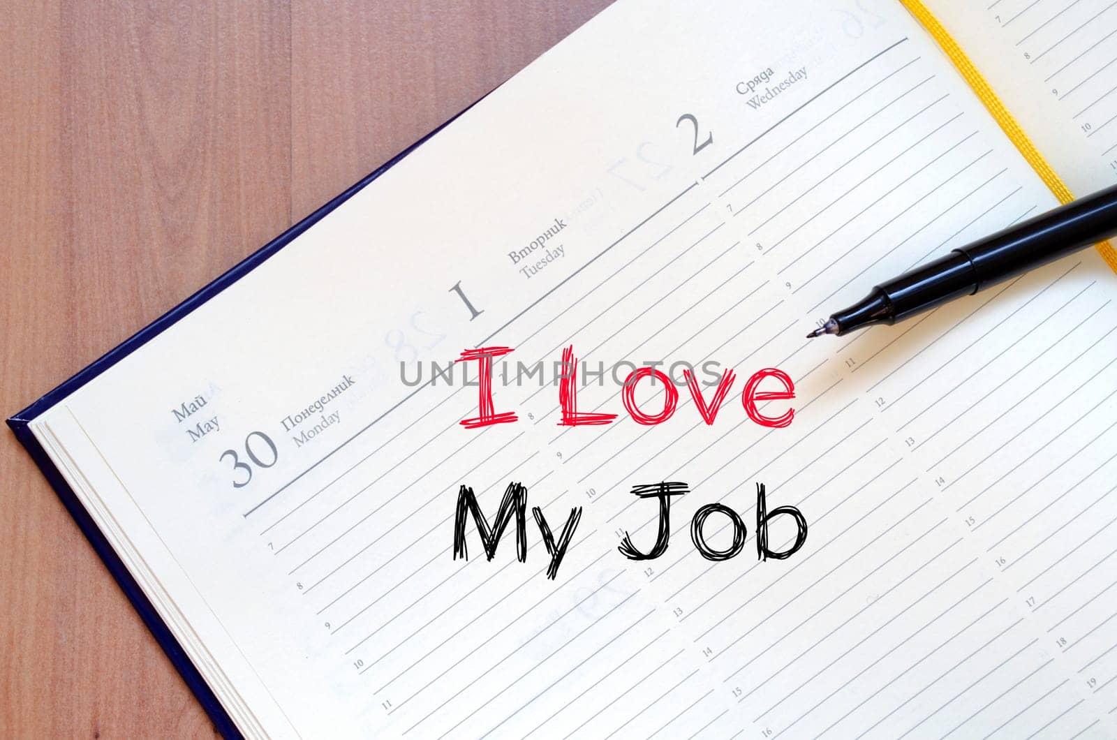 I love my job text concept write on notebook