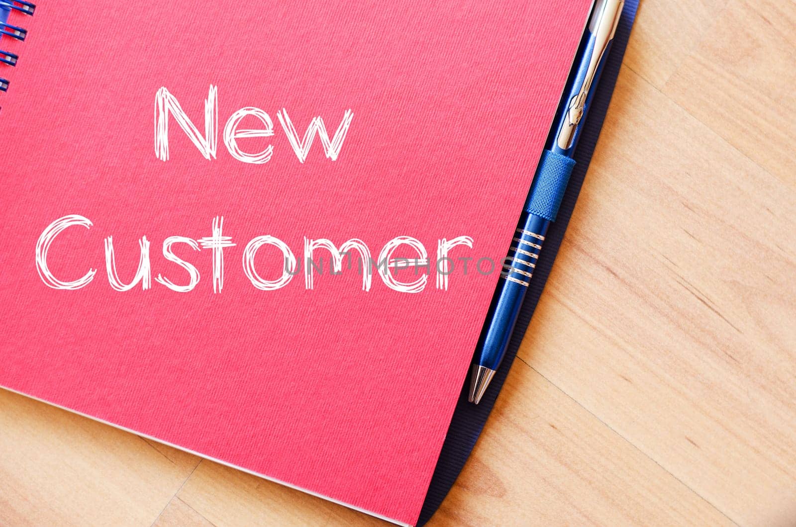 New customer text concept write on notebook