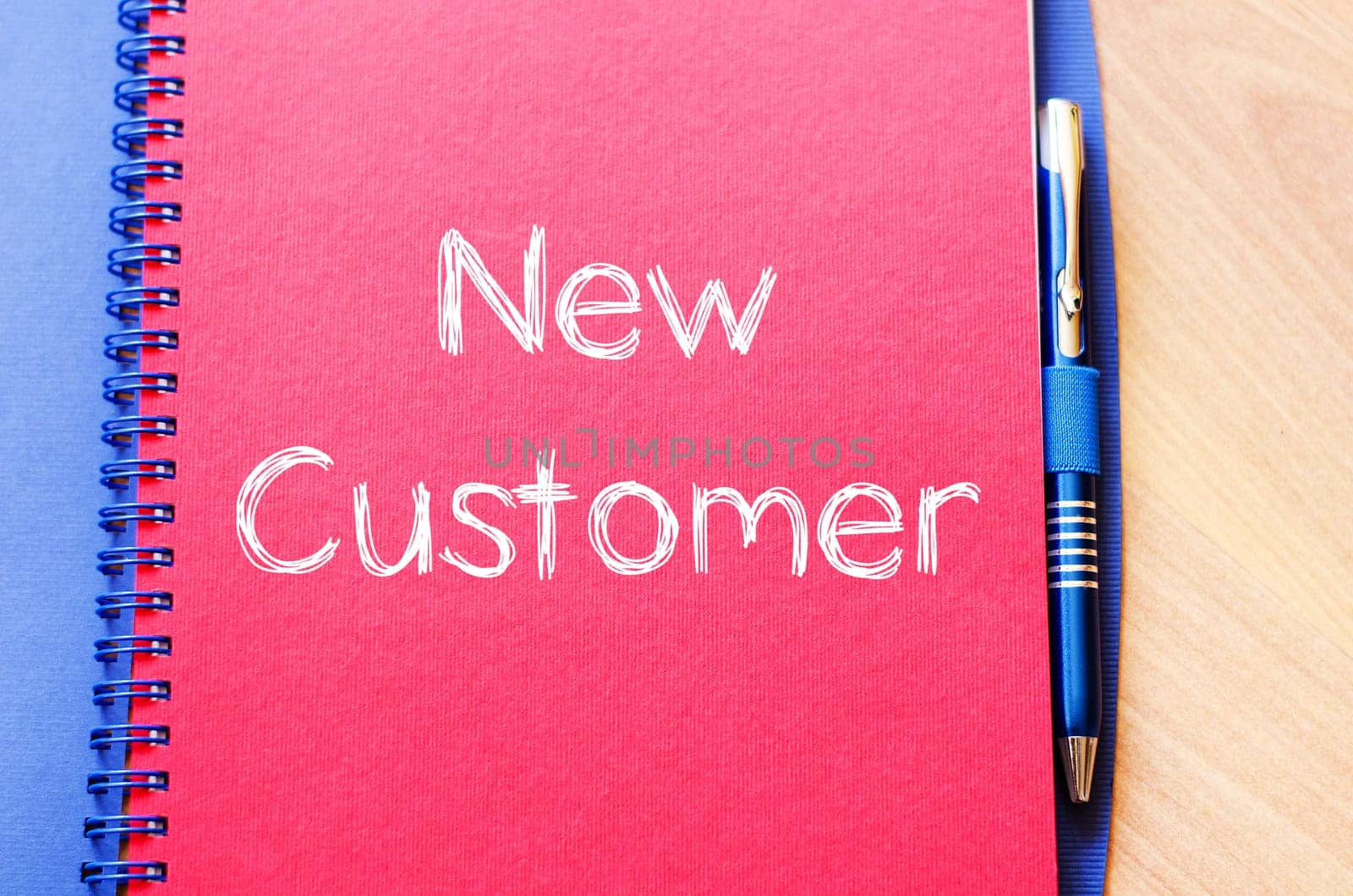 New customer text concept write on notebook