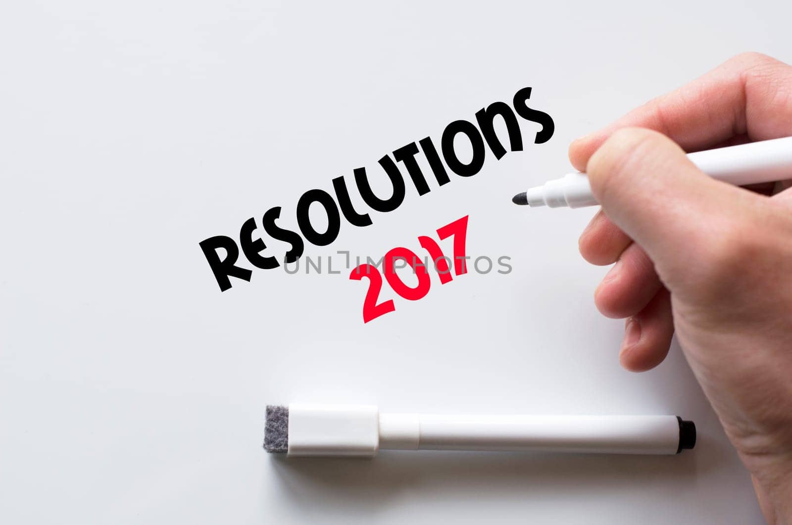 Human hand writing resolutions 2017 on whiteboard