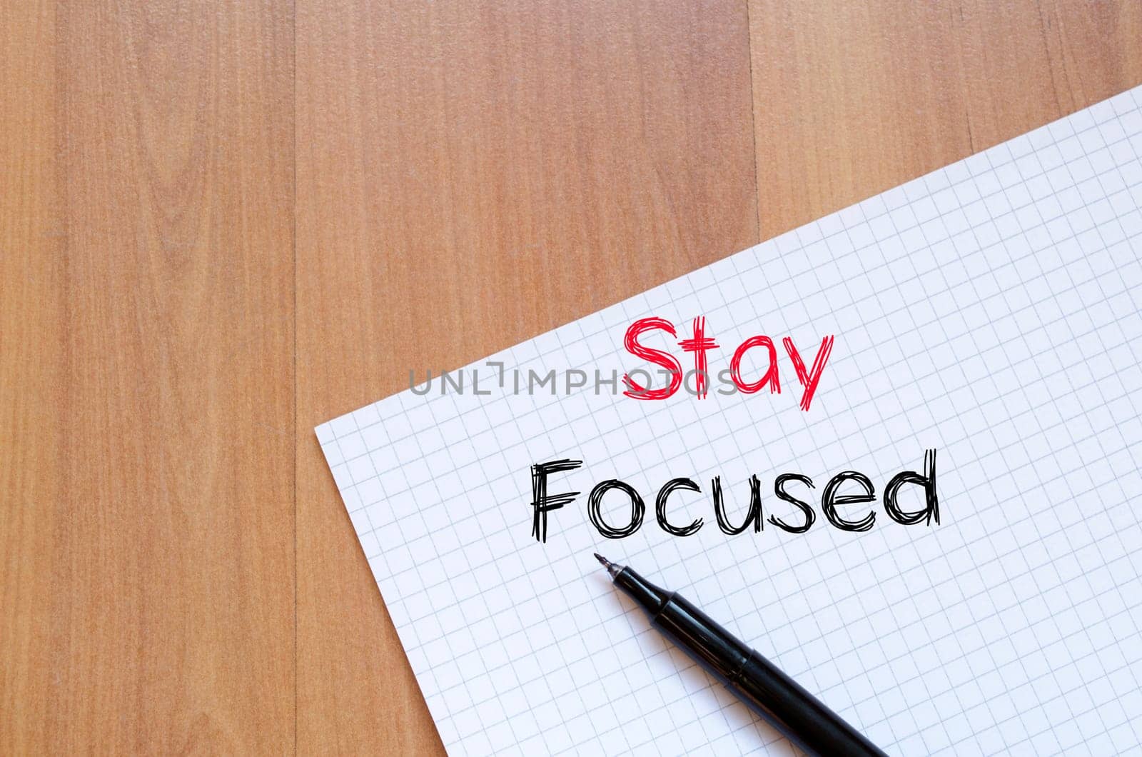 Stay focused text concept write on notebook