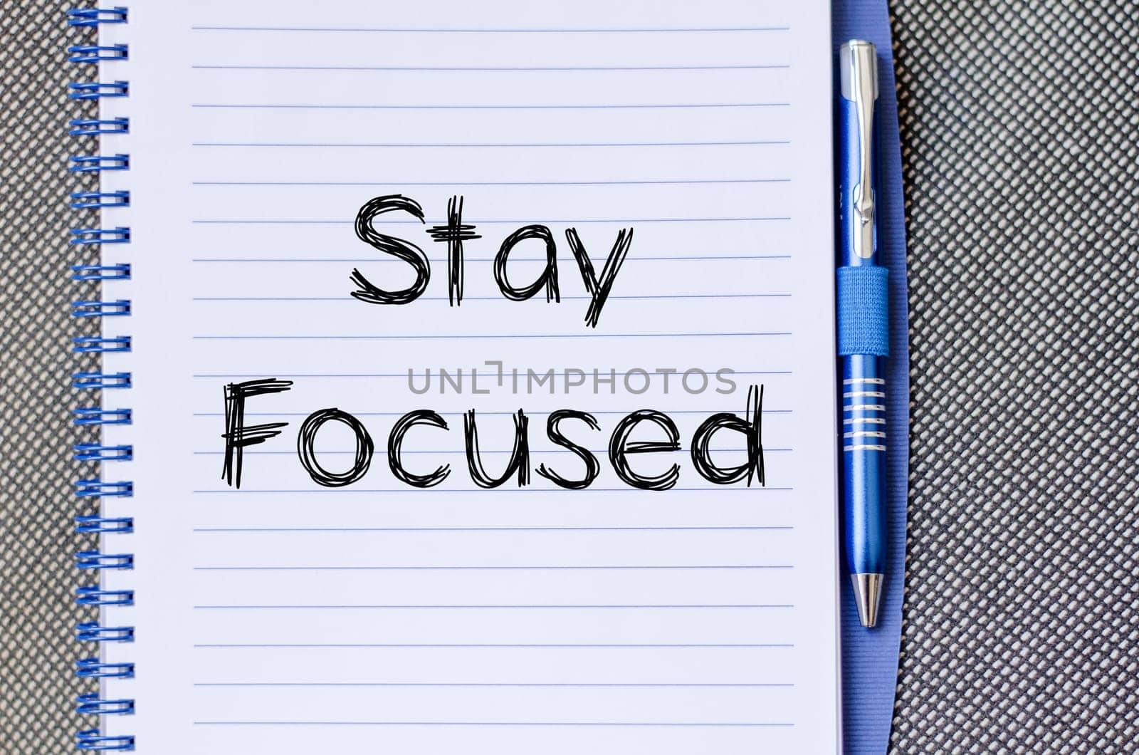 Stay focused text concept write on notebook