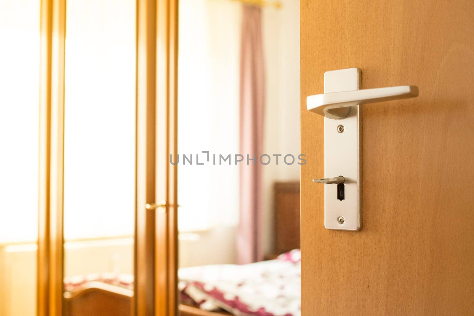Door from the bedroom with door handle,key and closet is open