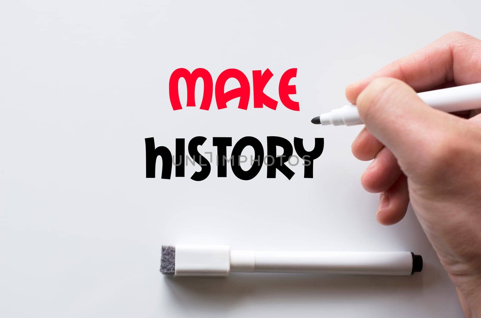 Human hand writing make history on whiteboard