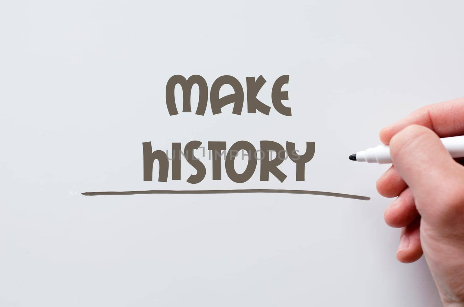 Human hand writing make history on whiteboard