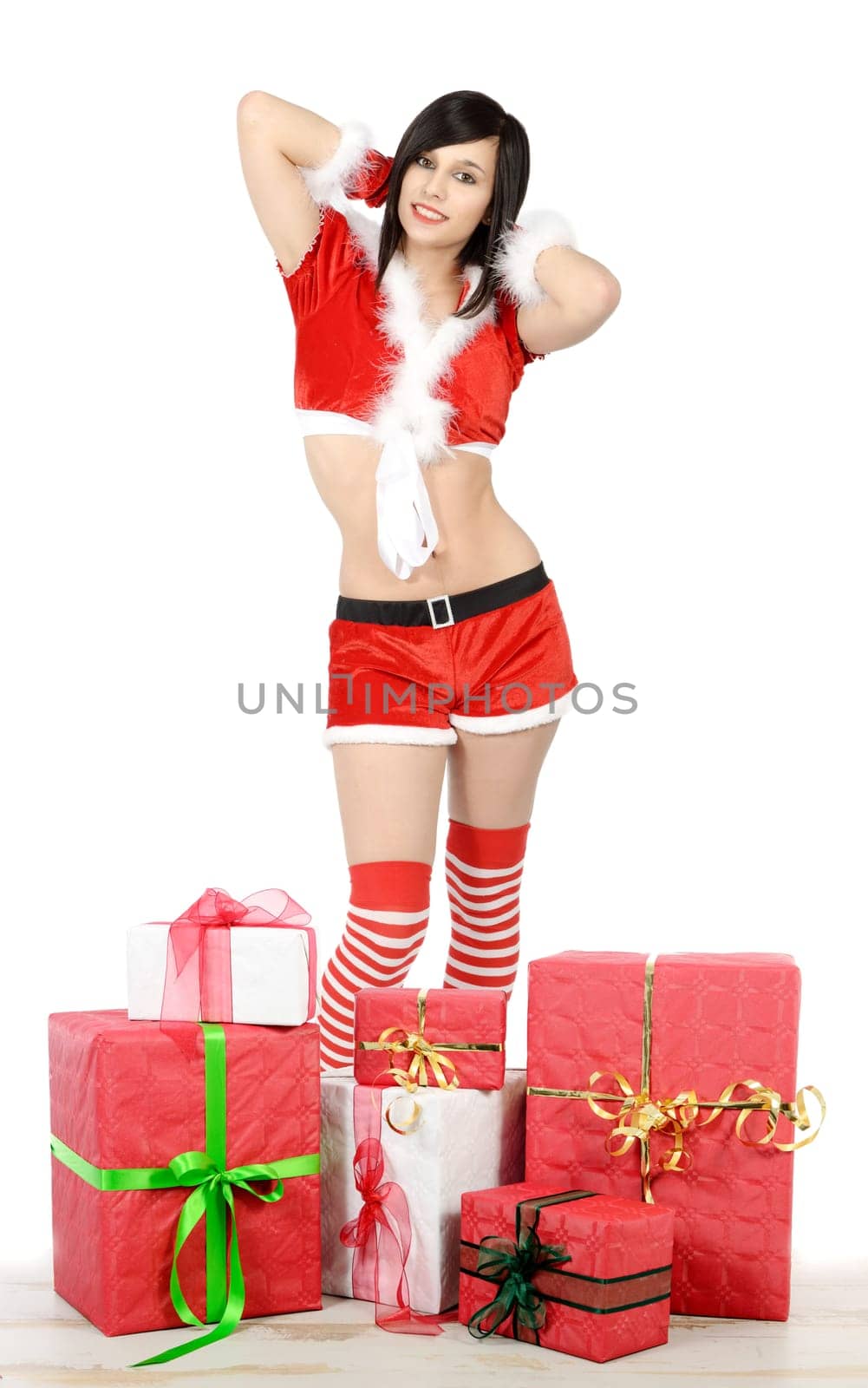beautiful young woman in santa claus costume with gift
