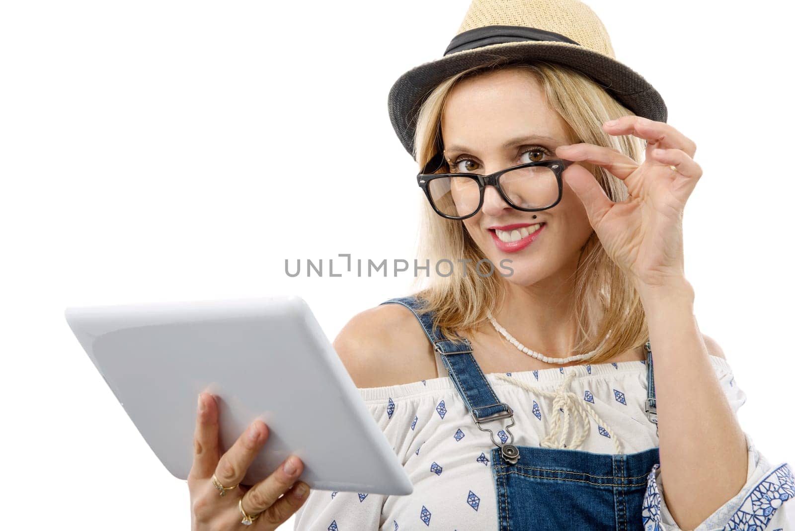 beautiful blond middle-aged woman with tablet computer